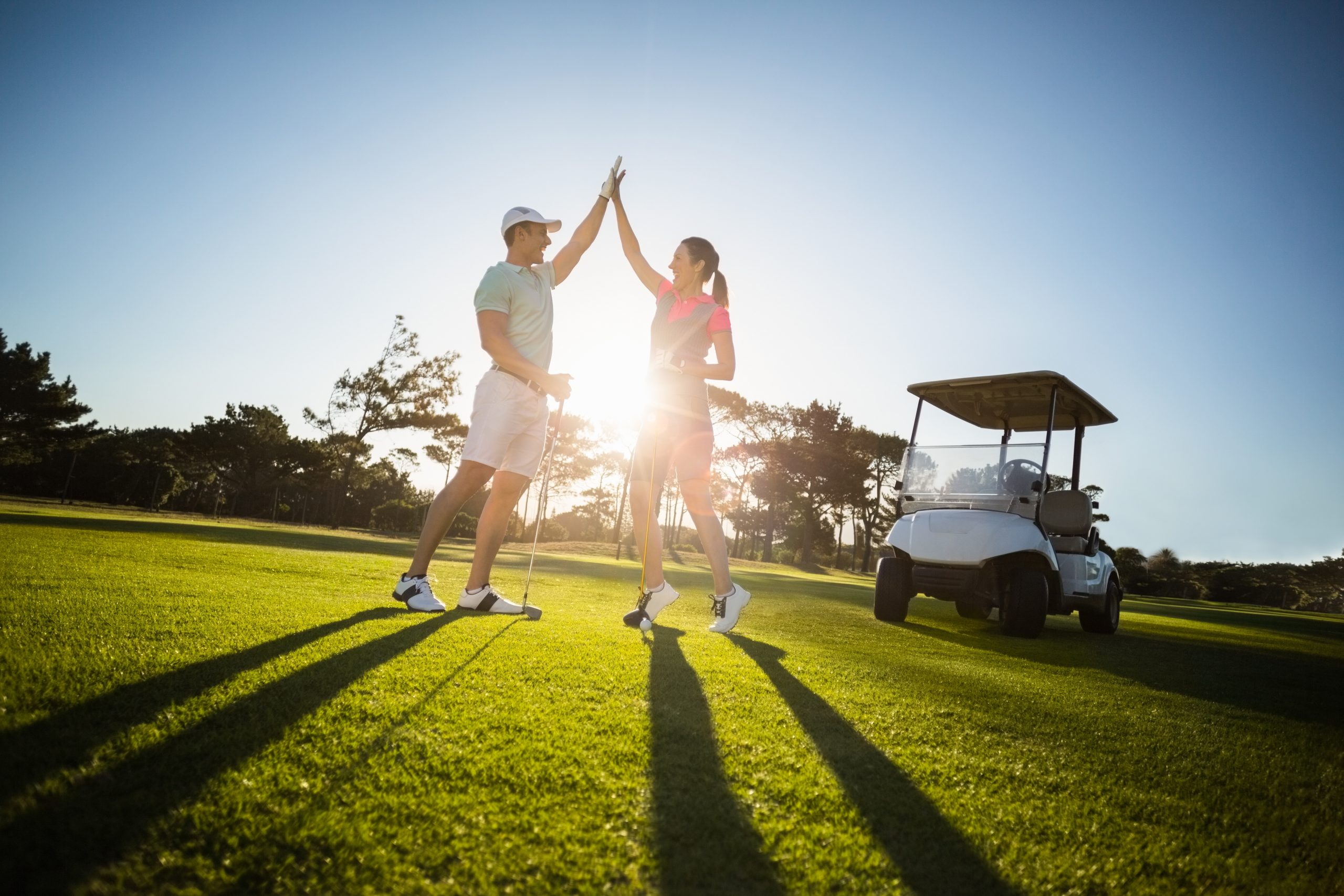 man_woman-golfers-high-5-scaled